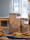" bags of Stone-milled all purpose flour by Sieda Milling, shown with baked biscuits and everyday baking ingredients