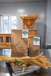 Stone-milled sifted bread flour by Sieda Milling, shown with wheat and artisan baking setup