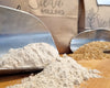 Stone-milled wholegrain flour from the Wholegrain Flour Box by Sieda Milling, shown with flour and grain for everyday baking