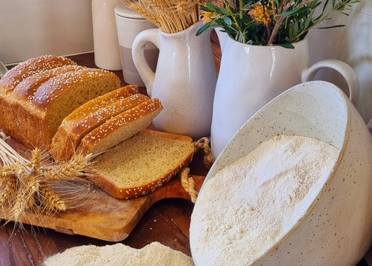Stone-milled flour from the Best of Both Flour Box by Sieda Milling, shown with bread and flour for everyday home baking with a farmhouse feel