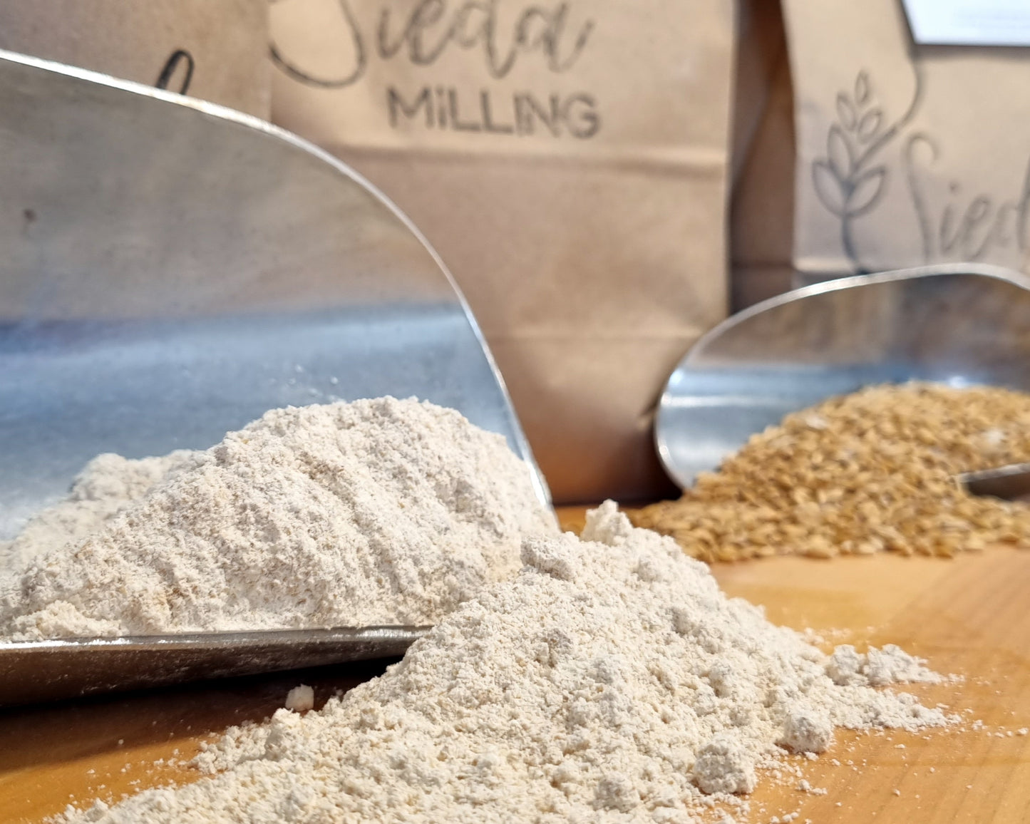Stone-milled wholegrain flour from the Wholegrain Flour Box by Sieda Milling, shown with flour and grain for everyday baking