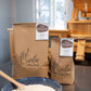 Two bags of Sieda Milling flour with a bowl of Sifted all purpose flour made from stone-milled wheat, ideal for cakes, muffins, and everyday baking